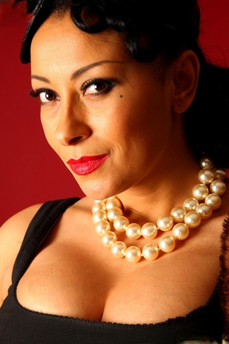 Ebony lady Danica Collins uncovers her big tits in black leather gloves 65619180