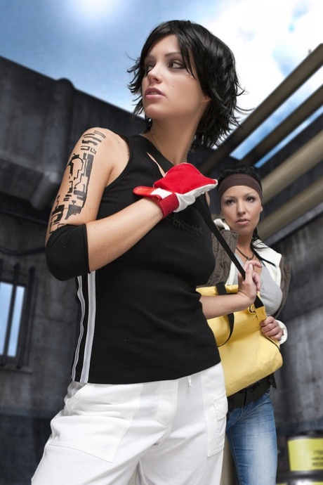 Lesbian cosplayers fondle each others firm breasts in an industrial setting 25603391
