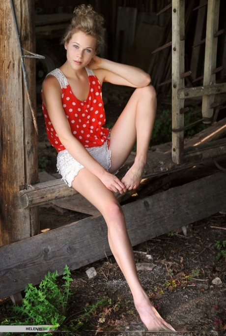 German teen Helena lets her curly hair down for nude poses in an old barn 27657223