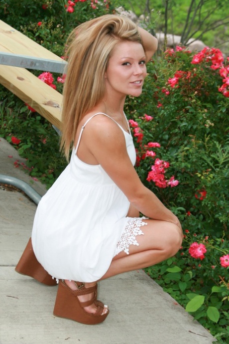 Amateur model flashes her upskirt panties out on the backyard patio 60114834