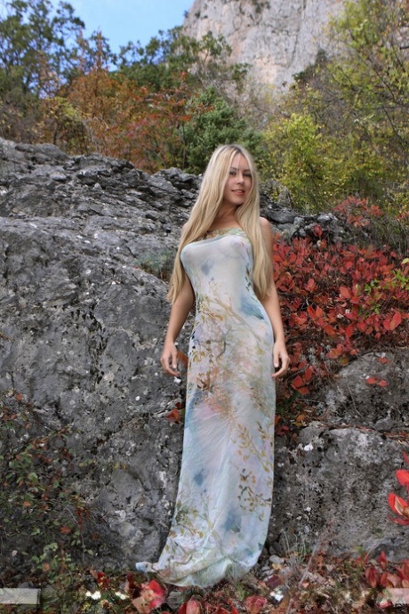 Hot blonde chick Rubie removes her dress for nude poses outdoors 52038511