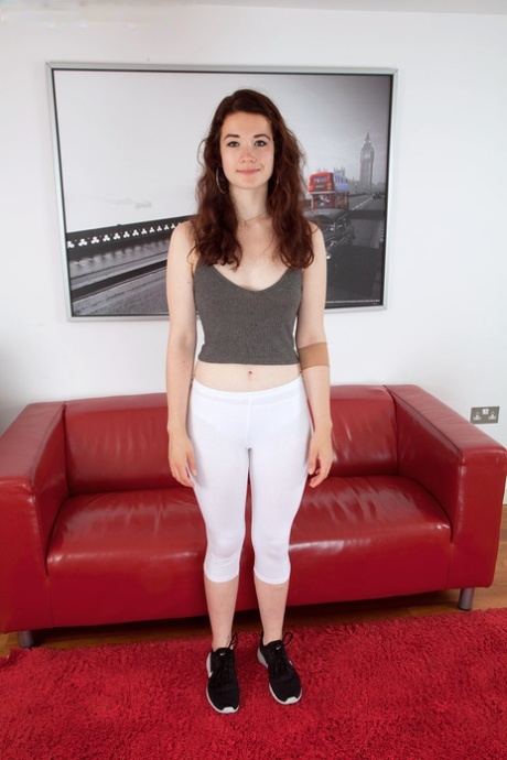 Pretty teen Flora slips her yoga pant down to flash her hairy muff 84187609