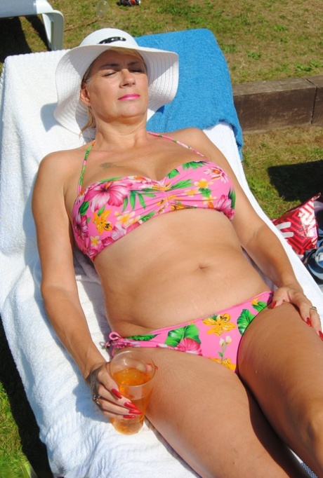 Mature British woman Denise Davies likes flashing her saggy tits in public 74769153
