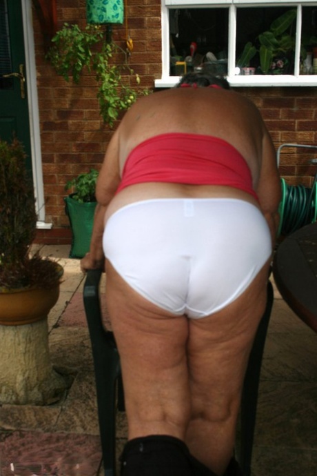 Fat oma Grandma Libby licks a nipple before baring her big ass on a patio 88542920