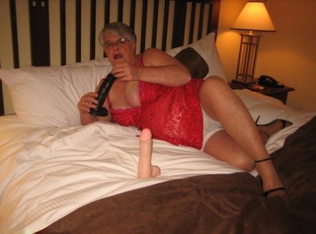 Fat granny Girdle Goddess whips out her big boobs on a bed in pantyhose 51152051