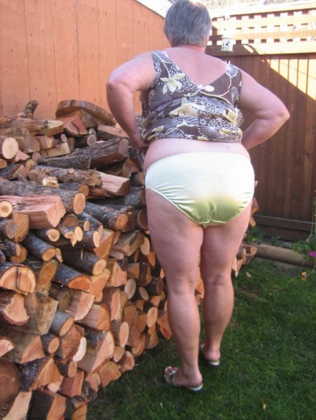 Brazen older granny strips off by the wood pile to show off BBW tits & big ass 70213770
