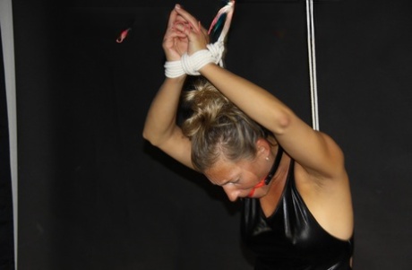 White girl is restrained with ropes while gagged in nylon gym shorts 50311387