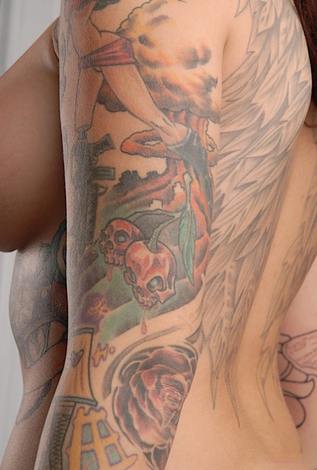 Solo model Emily Parker shows off her heavily tattooed body during closeups 93323065