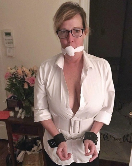 Busty woman finds herself bound and gagged in varying ways around her home 96532298