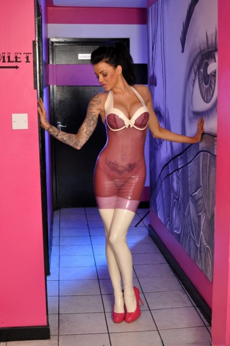 Dark haired solo girl models sheer latex clothing in white latex stockings 41645652