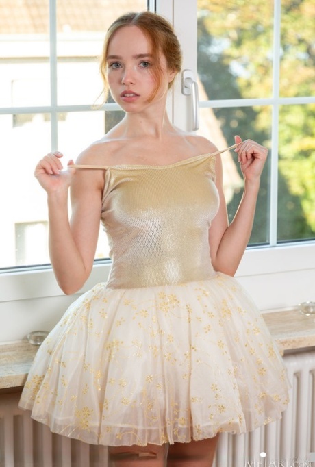 Young redhead Rinna Ly removes her ballerina clothing while getting naked 33226266