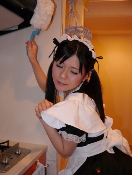 Japanese maid Mai Araki gives a BJ before being fitted with a sex toy 88322408
