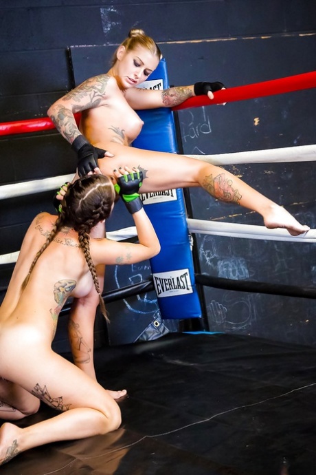 Female kick boxers settle their bout with lesbian sex in boxing ring 91616453